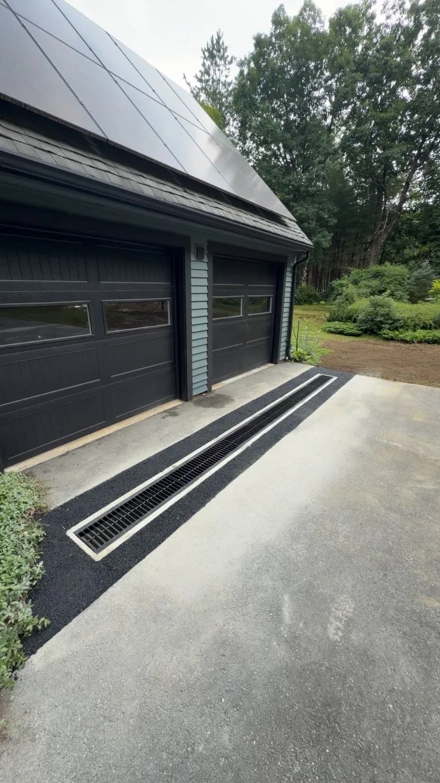 Trench Drain Install That Stops Water at the Garage Door image